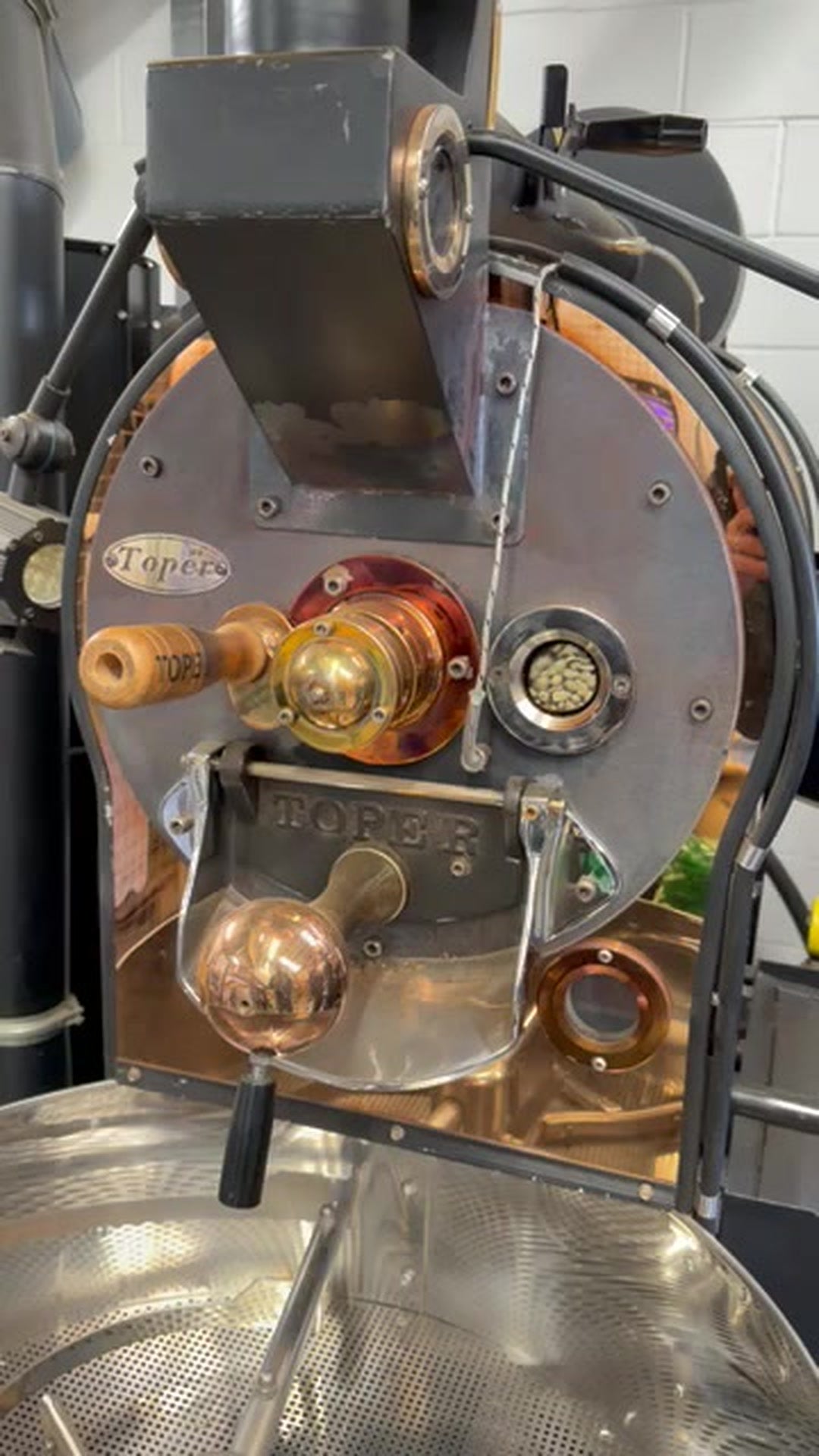 Front of the Toper roaster with beans in the sight glass